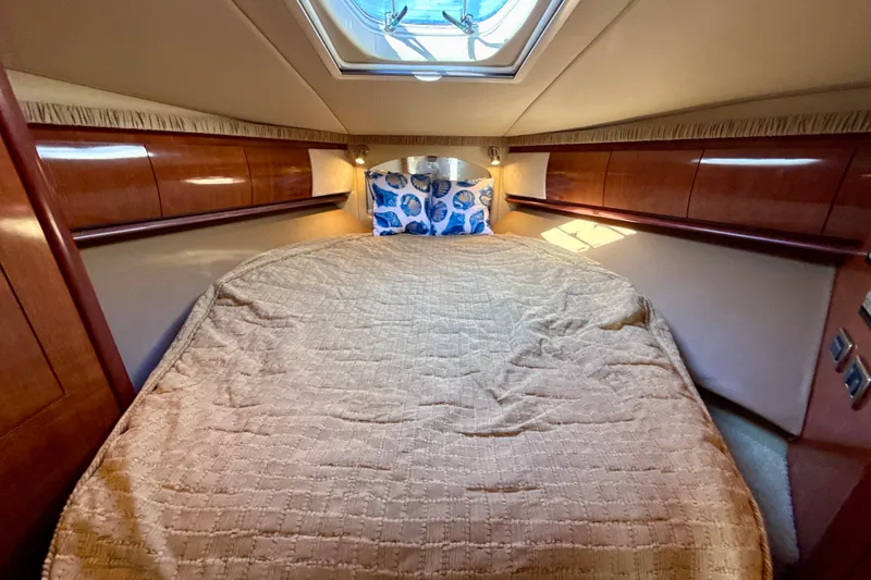 Slide: The Image of Luxurious cabin interior of 2005 Sea Ray 420 Sundancer yacht with cozy bedding. - 25