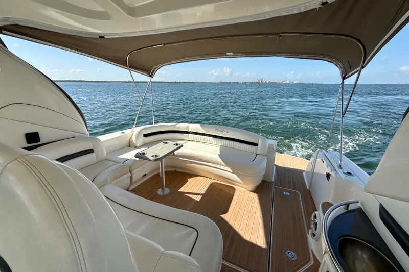 Slide: The Image of 2005 Sea Ray 420 Sundancer yacht interior with seating, table, and ocean view. - 14