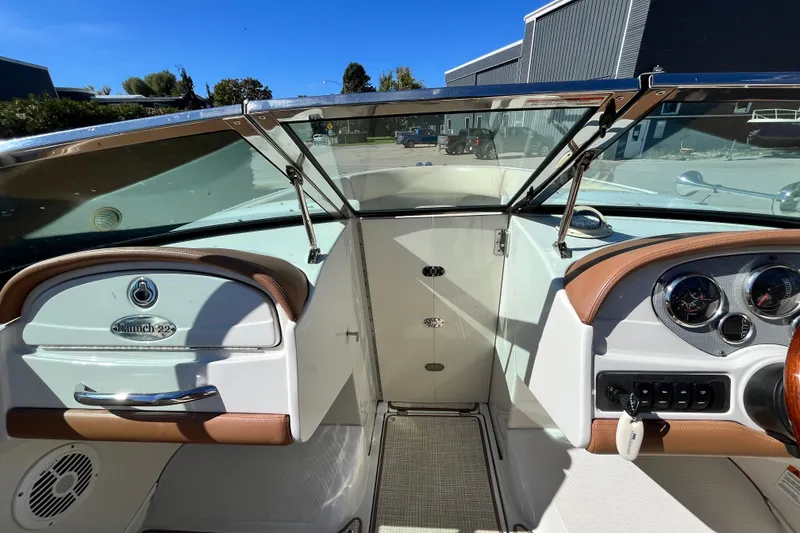 Slide: The Image of 2008 Chris-Craft Launch 22 boat interior with dashboard and steering wheel. - 10