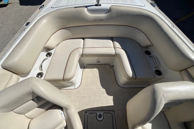 Slide: The Image of Luxurious interior of 2008 Chris-Craft Launch 22 boat with beige seating and cup holders. - 14