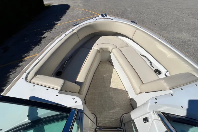 Slide: The Image of 2008 Chris-Craft Launch 22 boat interior with beige seating and carpeted floor. - 15