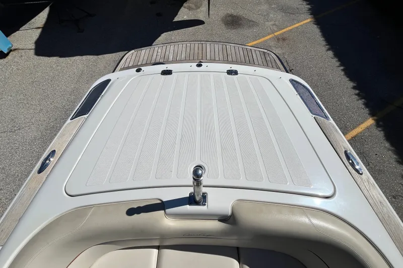 Slide: The Image of 2008 Chris-Craft Launch 22 boat deck with beige upholstery and wood accents. - 12