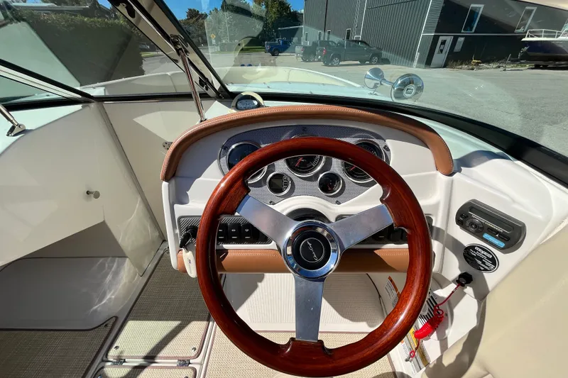 Slide: The Image of Steering wheel and dashboard of 2008 Chris-Craft Launch 22 boat. - 11