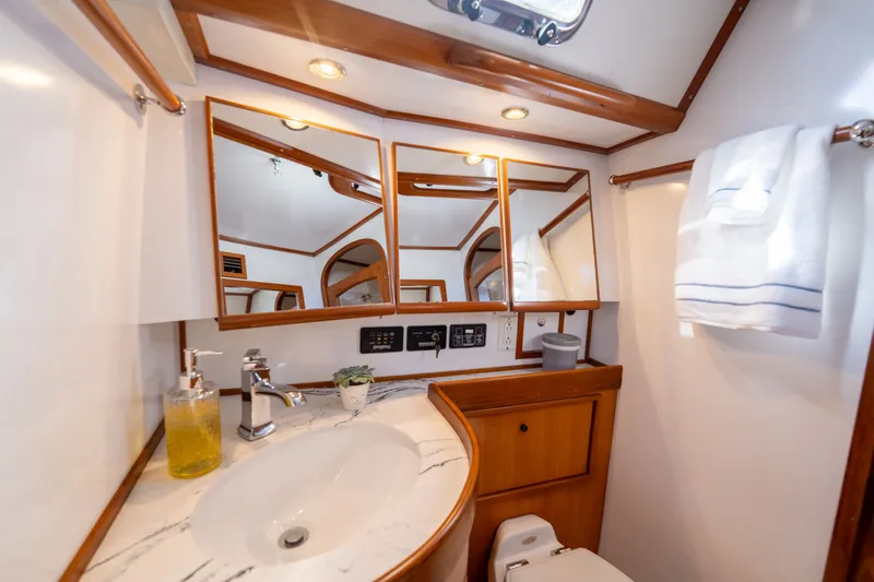 Slide: The Image of Luxurious bathroom interior of a 2004 Hylas 54 yacht with elegant wood accents. - 22