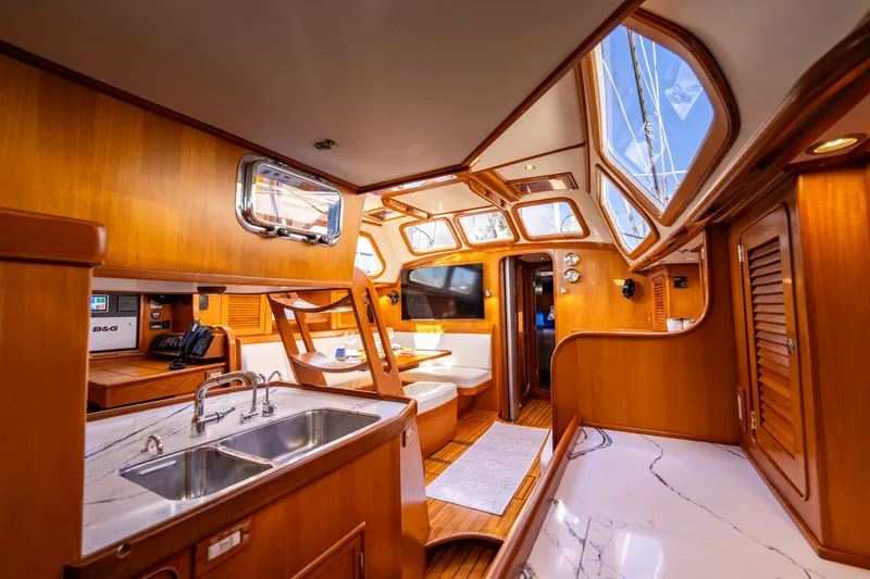 Slide: The Image of Luxurious interior of a 2004 Hylas 54 yacht with wood finishes and modern amenities. - 15