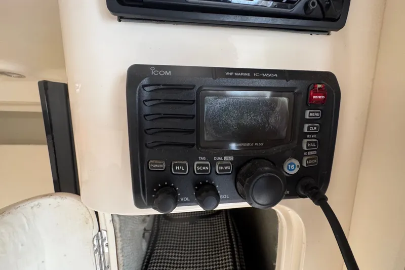 Slide: The Image of VHF marine radio on 2008 Intrepid 370 Cuddy boat dashboard. - 52