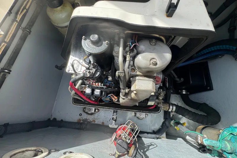 Slide: The Image of Engine compartment of a 2008 Intrepid 370 Cuddy boat, showcasing mechanical components. - 16