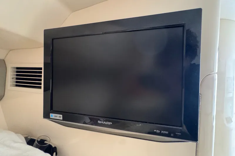 Slide: The Image of Sharp TV inside 2008 Intrepid 370 Cuddy boat cabin, mounted on wall. - 46
