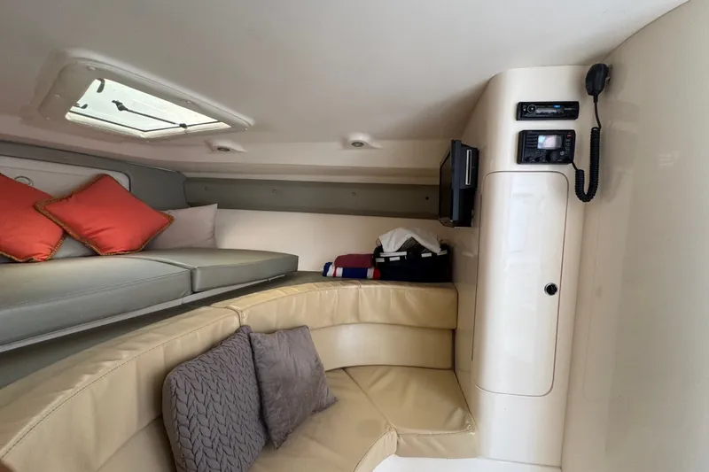 Slide: The Image of Interior of a 2008 Intrepid 370 Cuddy boat with seating and electronics. - 43