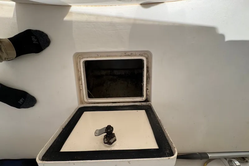 Slide: The Image of Open hatch on 2008 Intrepid 370 Cuddy boat deck, showing interior compartment. - 14