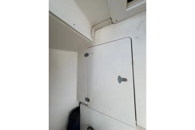 Slide: The Image of White storage compartment inside a 2008 Intrepid 370 Cuddy boat. - 39