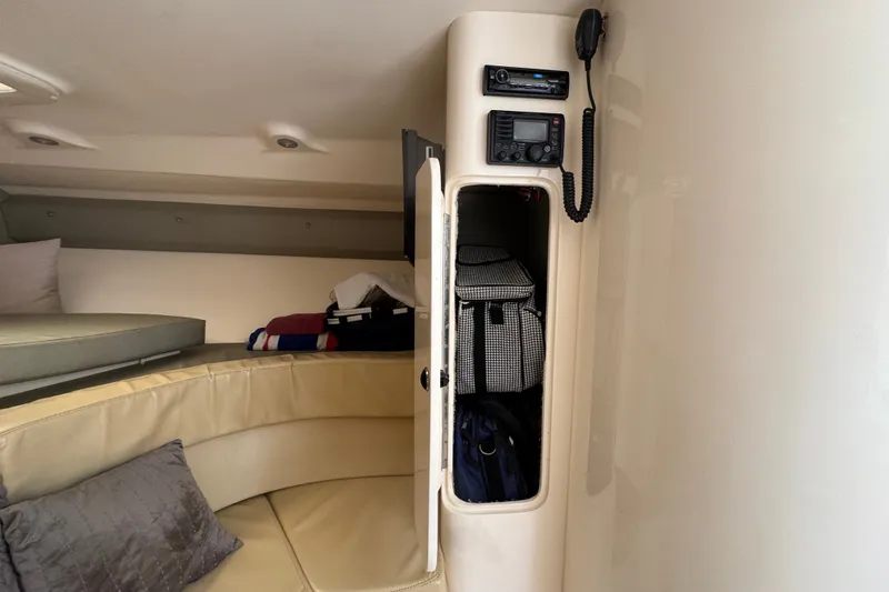 Slide: The Image of Interior of 2008 Intrepid 370 Cuddy with storage, seating, and communication equipment. - 44