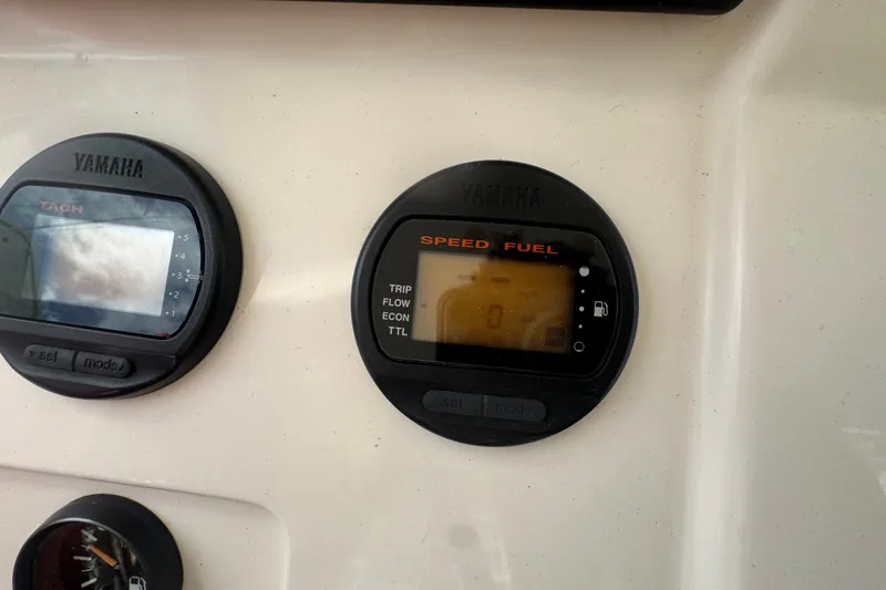 Slide: The Image of Yamaha gauges on a 2008 Intrepid 370 Cuddy boat dashboard. - 27