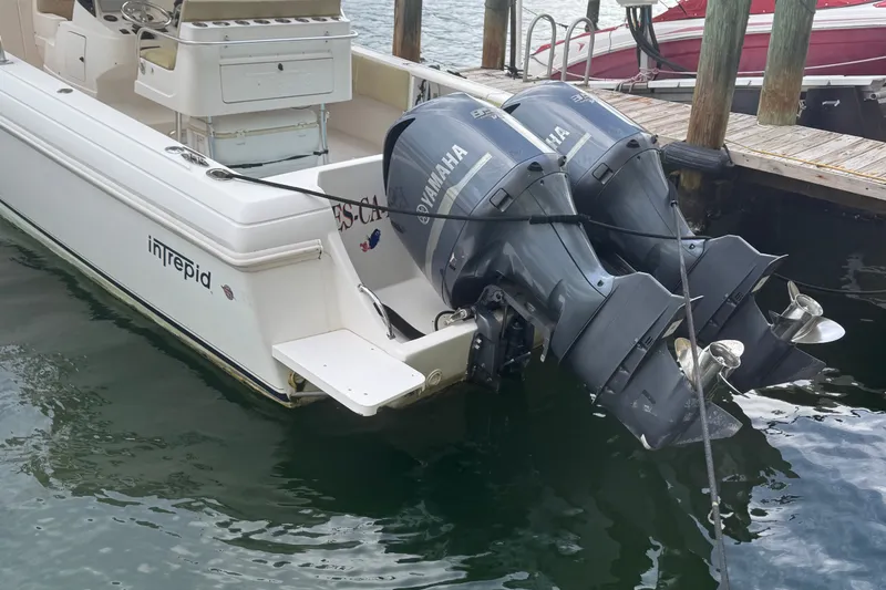 Slide: The Image of 2008 Intrepid 370 Cuddy boat with twin Yamaha outboard engines docked. - 67