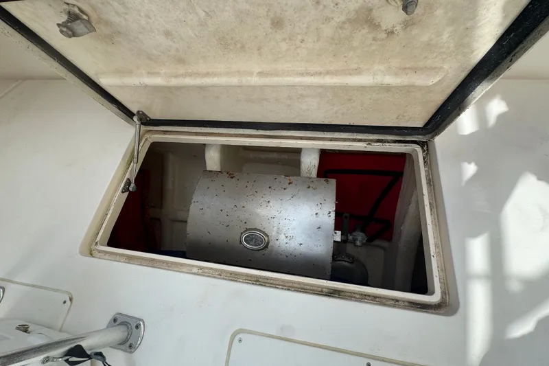 Slide: The Image of Open hatch revealing equipment inside a 2008 Intrepid 370 Cuddy boat. - 21