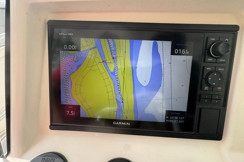 Slide: The Image of Garmin GPS display on 2008 Intrepid 370 Cuddy showing nautical chart and coordinates. - 29