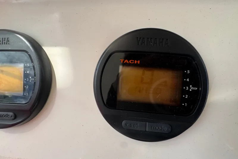 Slide: The Image of Yamaha tachometer on 2008 Intrepid 370 Cuddy boat dashboard. - 28