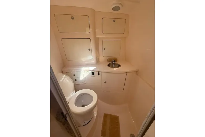 Slide: The Image of Compact bathroom in 2008 Intrepid 370 Cuddy boat with toilet and sink. - 49