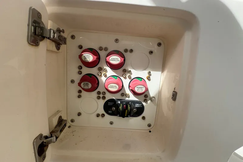 Slide: The Image of Electrical panel on a 2008 Intrepid 370 Cuddy boat with labeled switches and circuit module. - 33
