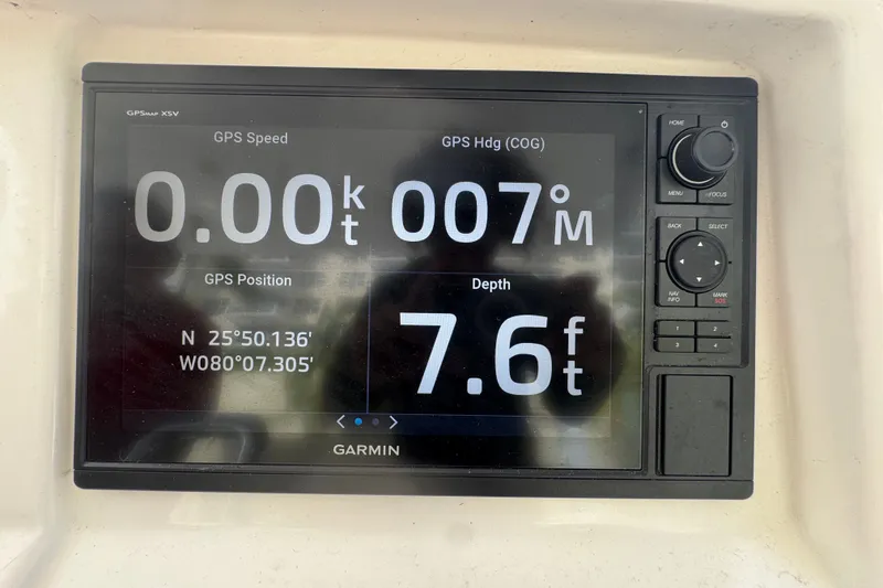 Slide: The Image of Garmin GPS display on 2008 Intrepid 370 Cuddy showing speed, heading, and depth. - 30
