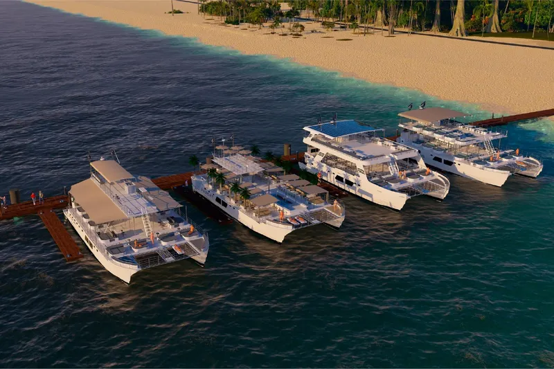 Slide: The Image of Cuatro yates Custom PAXCAT 2027 atracados en el muelle de la playa. - 16