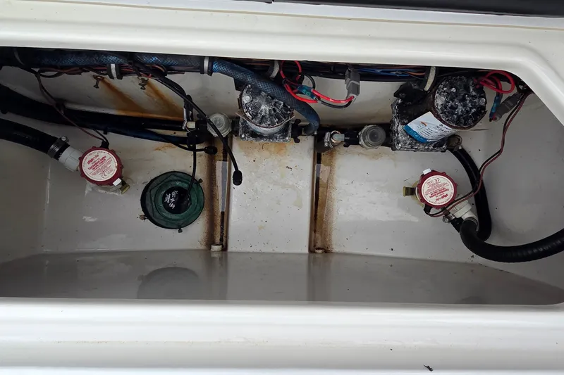 Slide: The Image of Bilge area of 2021 Sea Hunt Gamefish 27CB with pumps and wiring visible. - 25