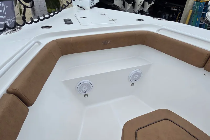 Slide: The Image of Interior view of 2021 Sea Hunt Gamefish 27CB boat with cushioned seating and speakers. - 24