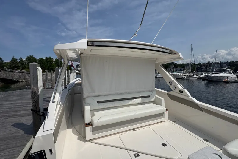 Slide: The Image of 2022 Tiara Yachts 43 LS docked, featuring a sleek design and spacious seating area. - 7