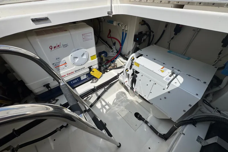 Slide: The Image of Engine compartment of 2022 Tiara Yachts 43 LS, featuring a Fischer Panda generator. - 8