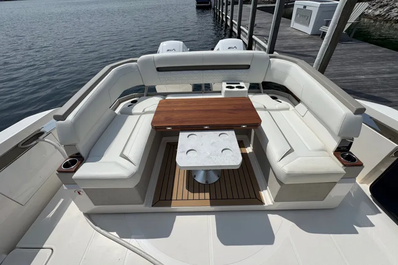Slide: The Image of Luxury seating area on 2022 Tiara Yachts 43 LS, featuring elegant wood and leather finishes. - 2