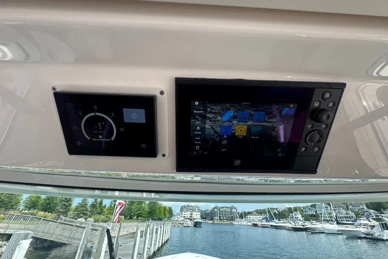 Slide: The Image of Dashboard of 2022 Tiara Yachts 43 LS with navigation and control screens. - 15