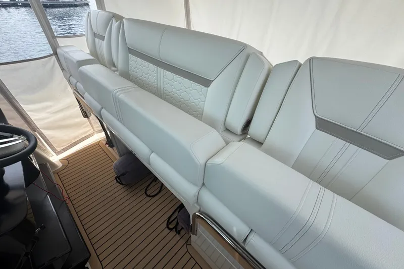 Slide: The Image of Luxurious seating on 2022 Tiara Yachts 43 LS, featuring elegant white upholstery and modern design. - 18