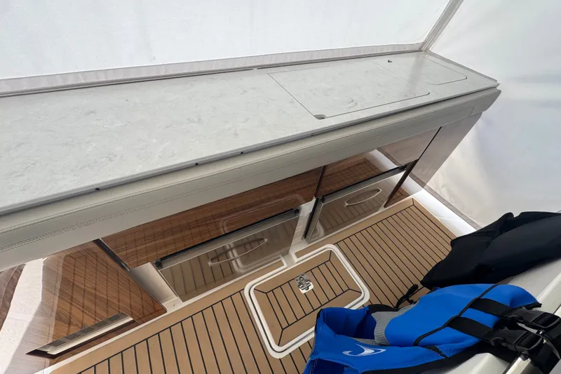 Slide: The Image of 2022 Tiara Yachts 43 LS interior with sleek cabinetry and modern design elements. - 24