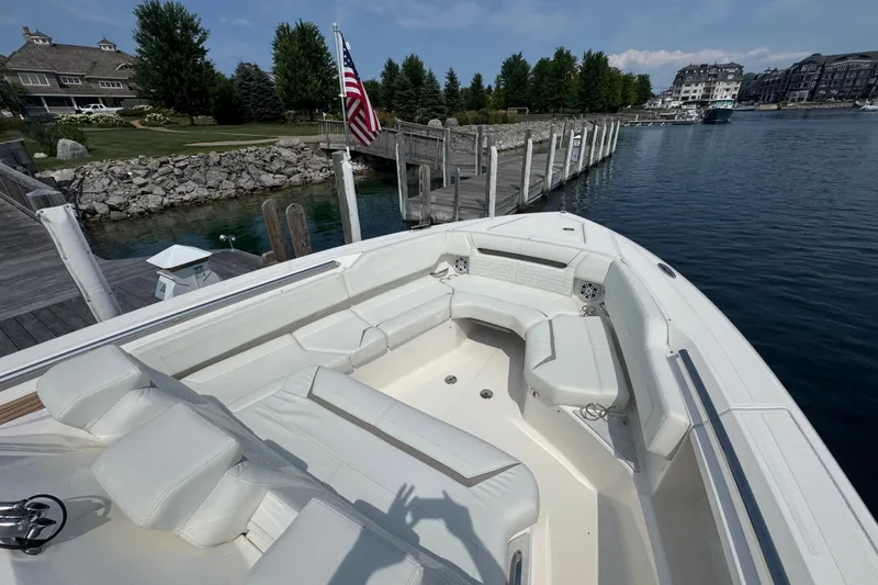 Slide: The Image of 2022 Tiara Yachts 43 LS docked, featuring spacious seating and elegant design. - 10