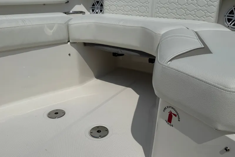 Slide: The Image of 2022 Tiara Yachts 43 LS interior seating with fire extinguisher compartment. - 13