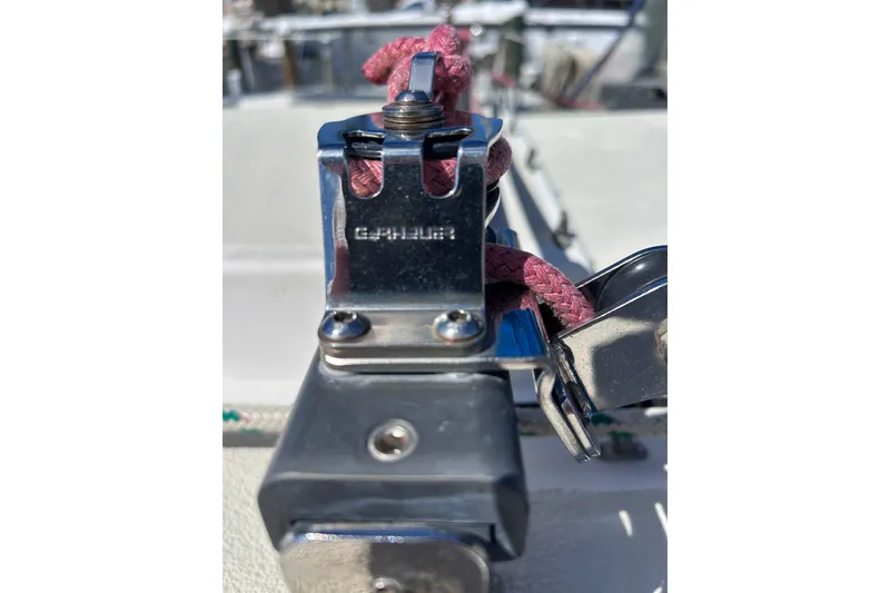 Slide: The Image of Close-up of a 1979 Tartan 37 sailboat's metal fitting with red rope. - 64
