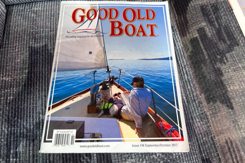 Slide: The Image of Good Old Boat magazine cover featuring a serene sailing scene on a Tartan 37, 1979 model. - 54