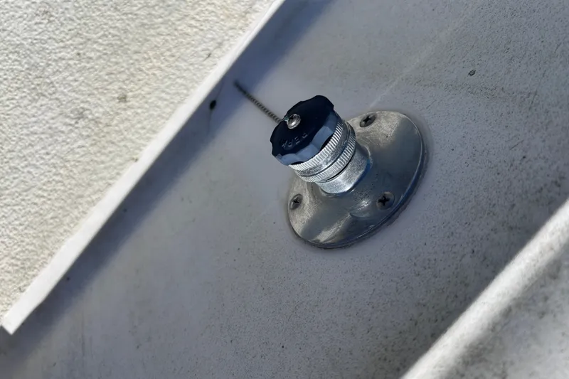 Slide: The Image of Close-up of a metal fitting on a 1979 Tartan 37 boat deck. - 61