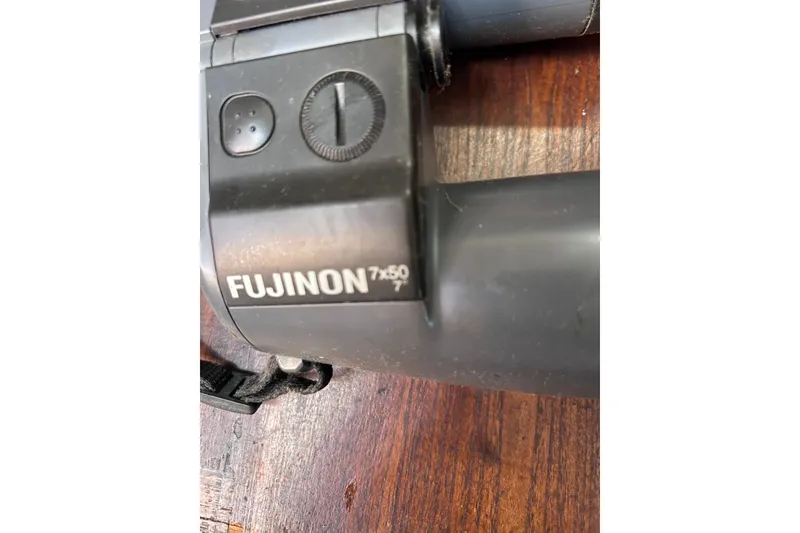 Slide: The Image of Close-up of Fujinon 7x50 binoculars on a wooden surface. - 66