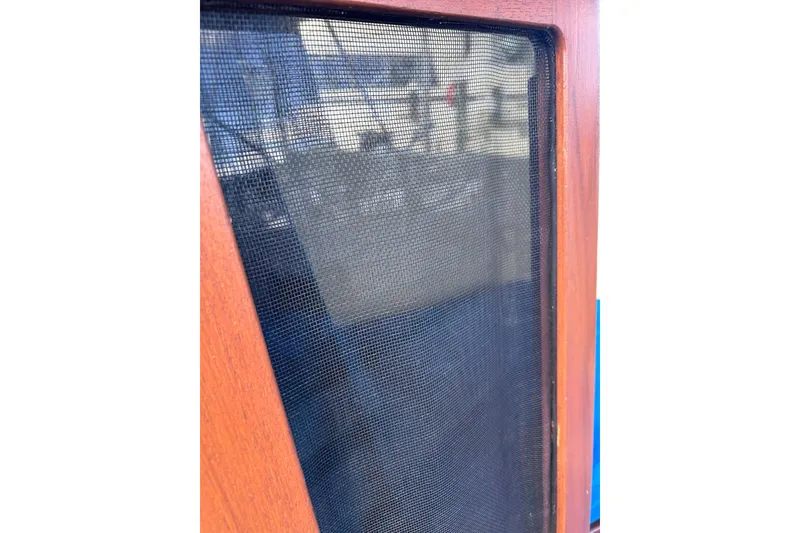 Slide: The Image of Wooden-framed mesh screen on a 1979 Tartan 37 sailboat. - 58