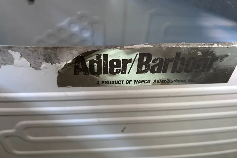Slide: The Image of Adler/Barbour label on vintage Tartan 37, 1979 model, showing wear and age. - 49