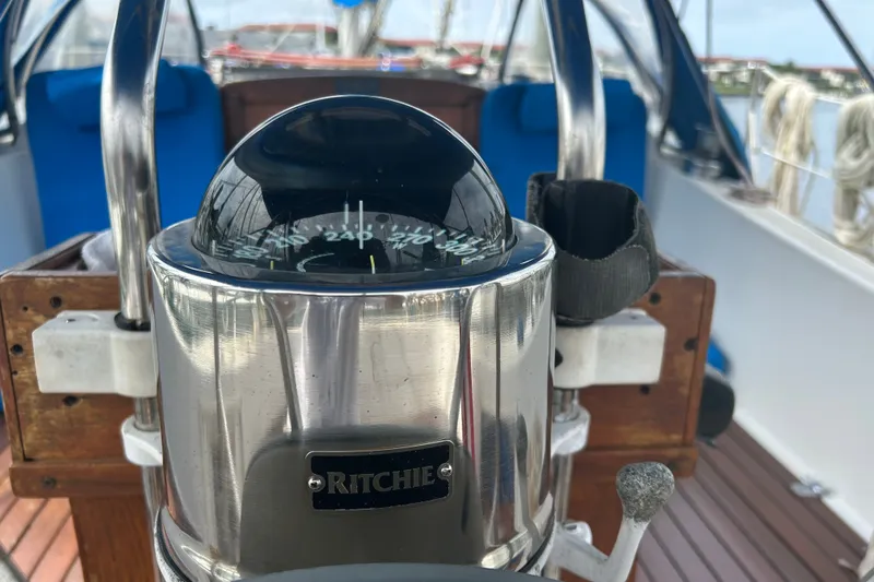Slide: The Image of Compass on a 1979 Tartan 37 sailboat, featuring a Ritchie navigation instrument. - 14