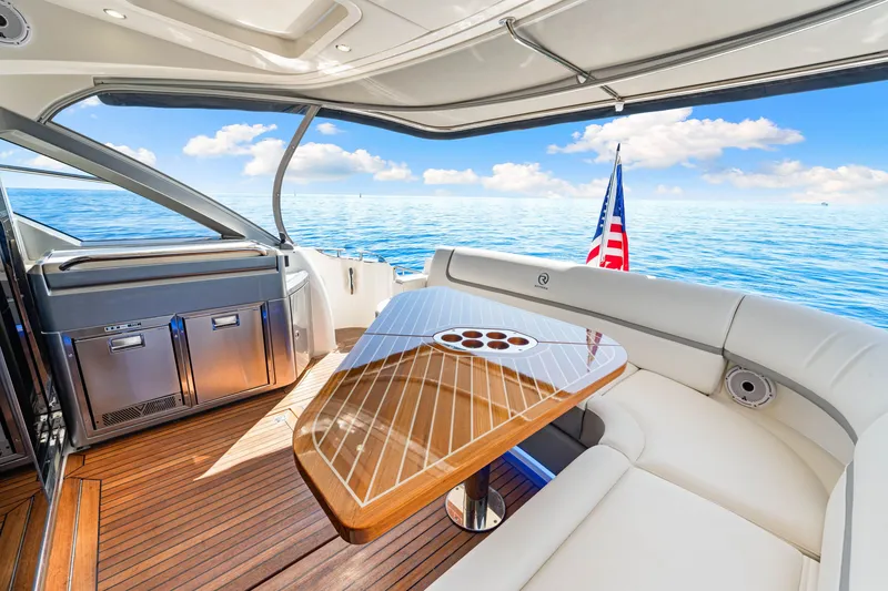 Slide: The Image of Luxurious 2024 Riviera 4600 Sport Yacht Platinum Edition interior with ocean view. - 29