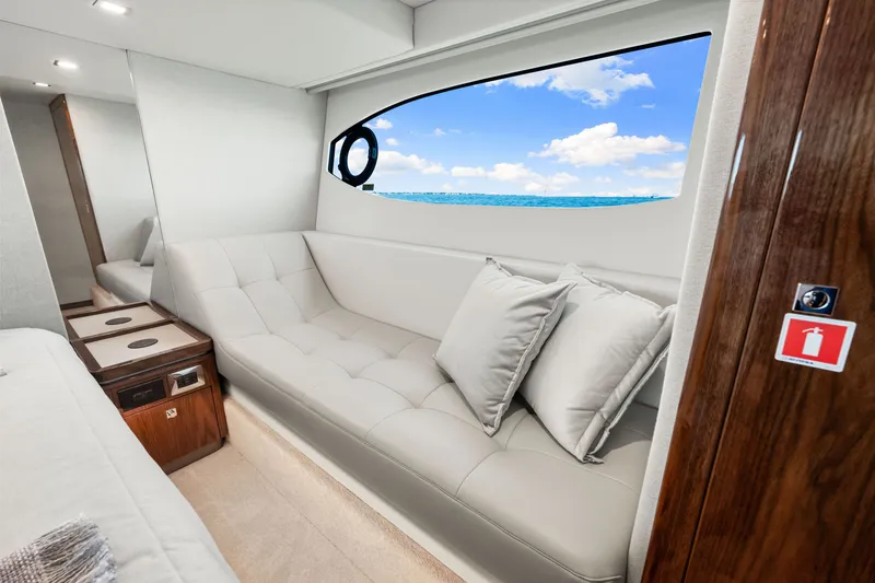 Slide: The Image of Luxurious interior of 2024 Riviera 4600 Sport Yacht Platinum Edition with ocean view. - 58