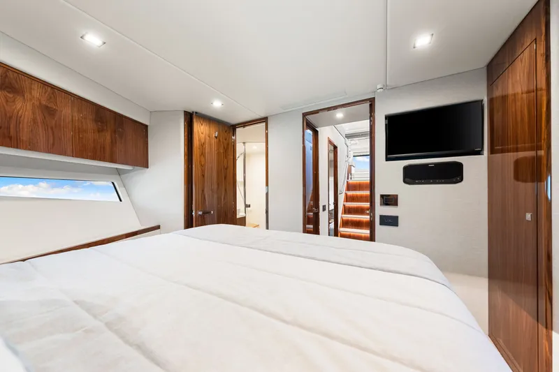 Slide: The Image of Luxurious interior of 2024 Riviera 4600 Sport Yacht Platinum Edition bedroom. - 64