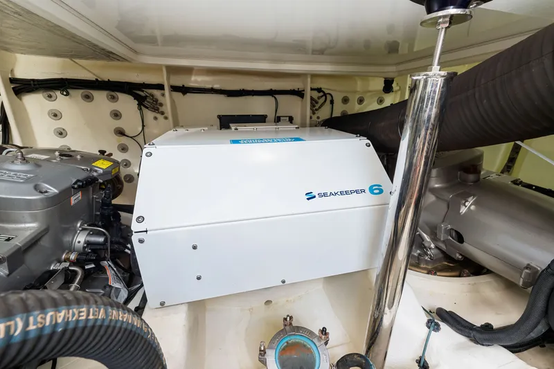 Slide: The Image of Engine room of 2024 Riviera 4600 Sport Yacht Platinum Edition with Seakeeper 6 stabilizer. - 71