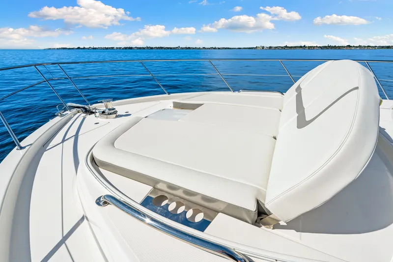 Slide: The Image of Luxurious 2024 Riviera 4600 Sport Yacht Platinum Edition on serene blue waters. - 37