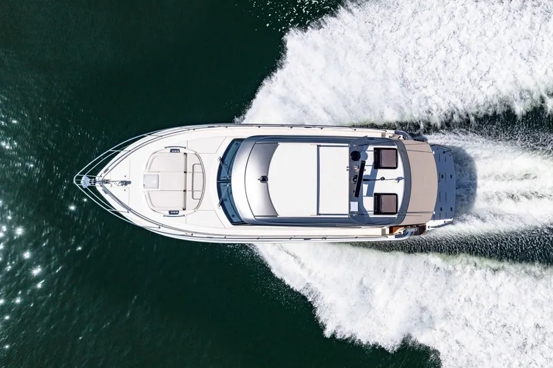 Slide: The Image of Top view of 2024 Riviera 4600 Sport Yacht Platinum Edition cruising on water. - 16