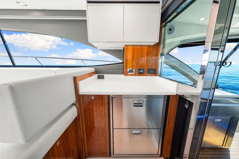 Slide: The Image of Luxurious interior of 2024 Riviera 4600 Sport Yacht Platinum Edition with ocean view. - 47