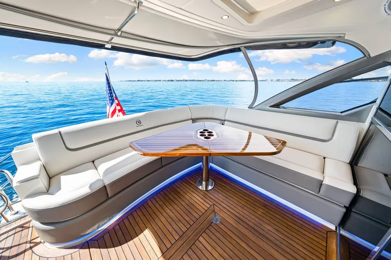 Slide: The Image of Luxurious 2024 Riviera 4600 Sport Yacht Platinum Edition interior with ocean view. - 28